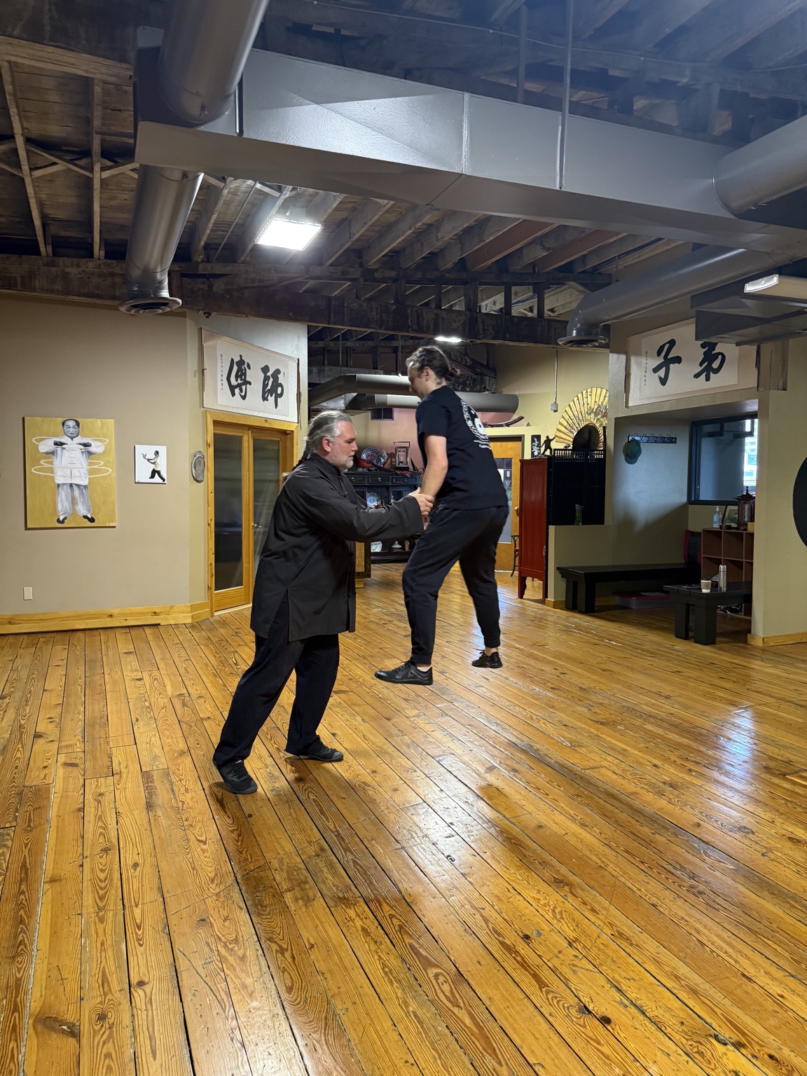 Michael Paler demonstrating peng jin with Jake